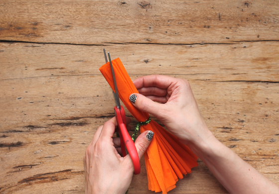 cutting out your orange crepe paper concertina stripes