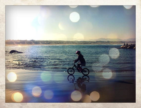 cycling helmeted girl live life ritoque beach chile