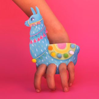 human fingers in a paper llama puppet