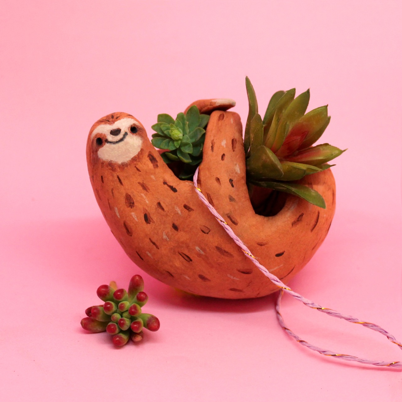 Bring nature into your house with this easy homemade sloth planter