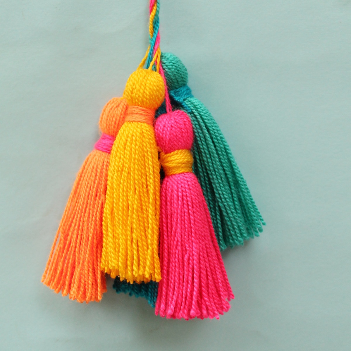 Easy DIY yellow, red, orange, green and blue tassels for decorations